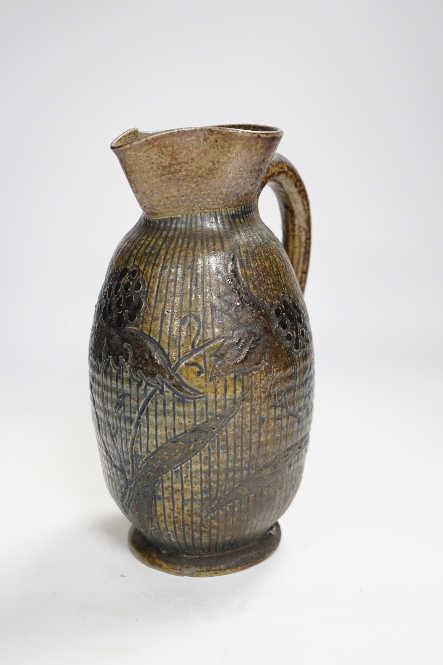A R W Martin Brothers, London and Southall stoneware jug, repaired, mark to base, 22cm high